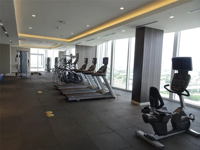 a view of a swimming pool and furniture