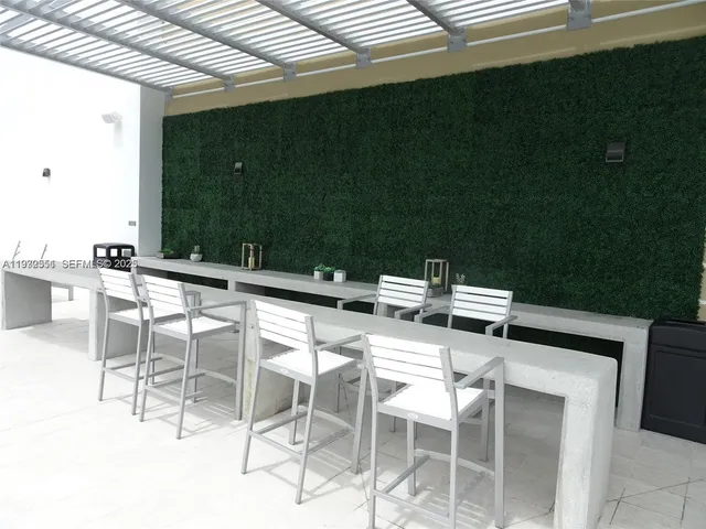 a view of roof deck with seating space