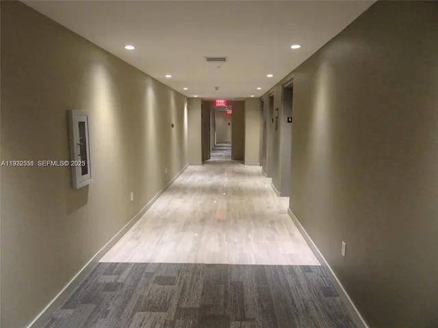 a view of entryway with wooden floor