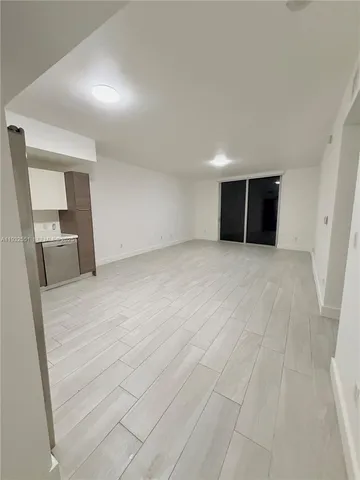 an empty room with a bathroom