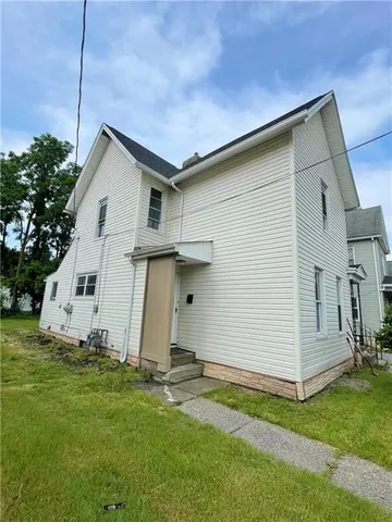 a front view of house with yard