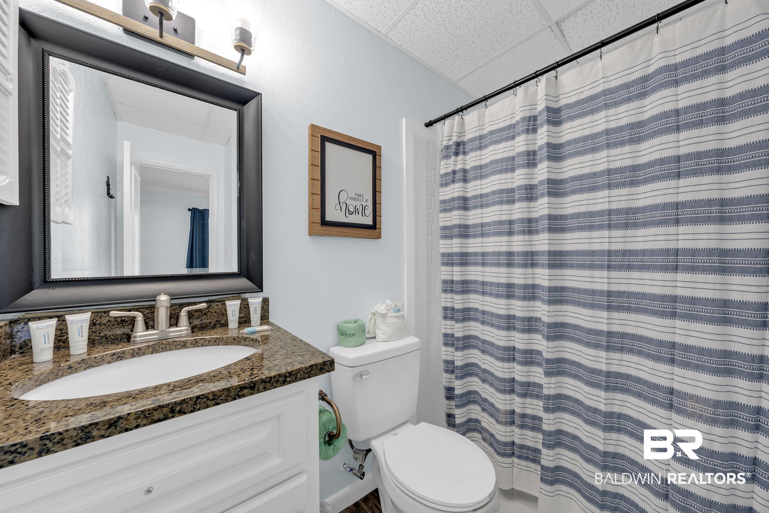 400 Plantation Road, Unit 2118 Gulf Shores, AL 36542 - Photo 18 of 59 Bathroom featuring a single vanity with a granite countertop, undermount sink, and brushed nickel faucet