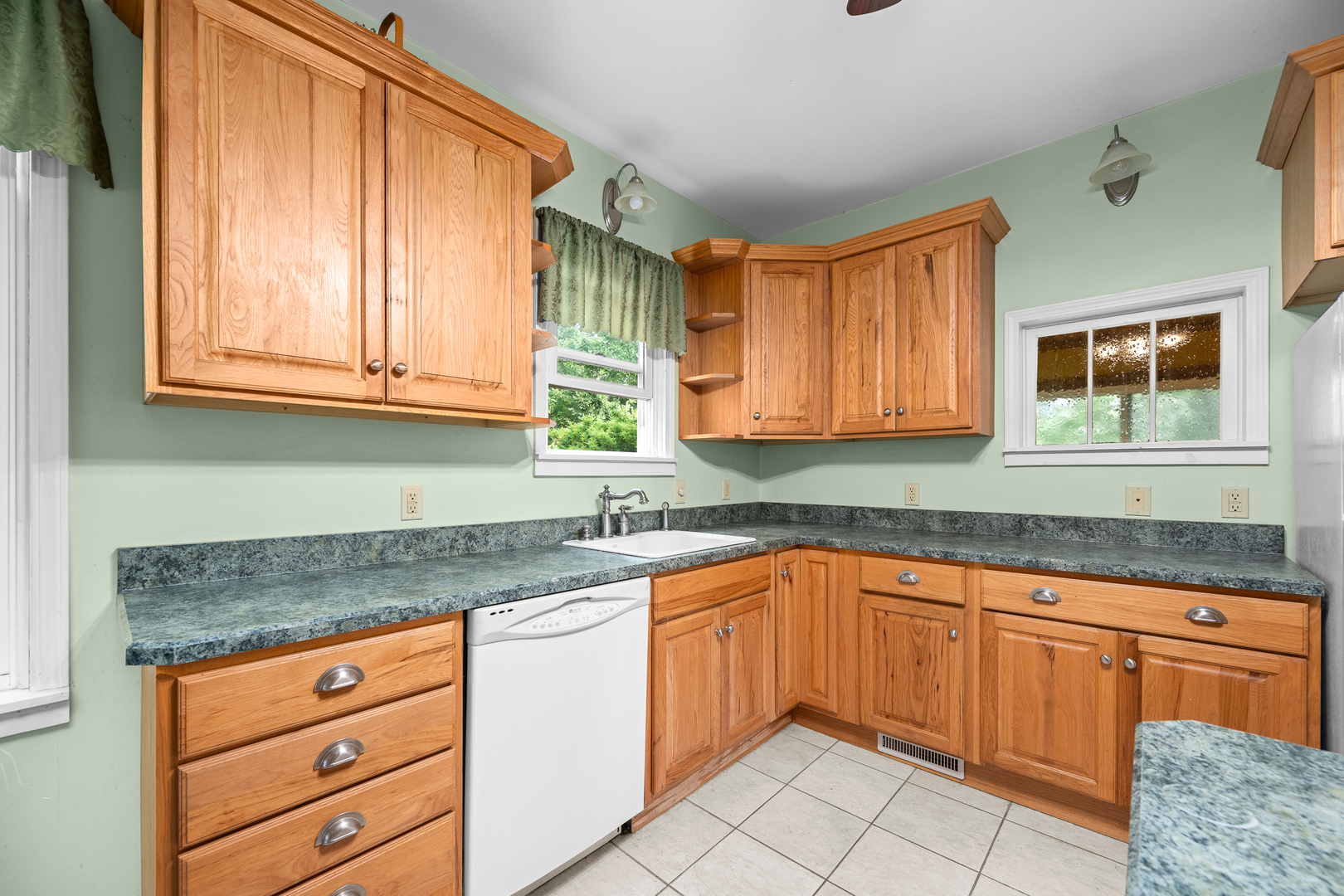 802 North High Street Port Byron, IL 61275 - Photo 20 of 43 a kitchen with granite countertop stainless steel appliances white cabinets sink and window
