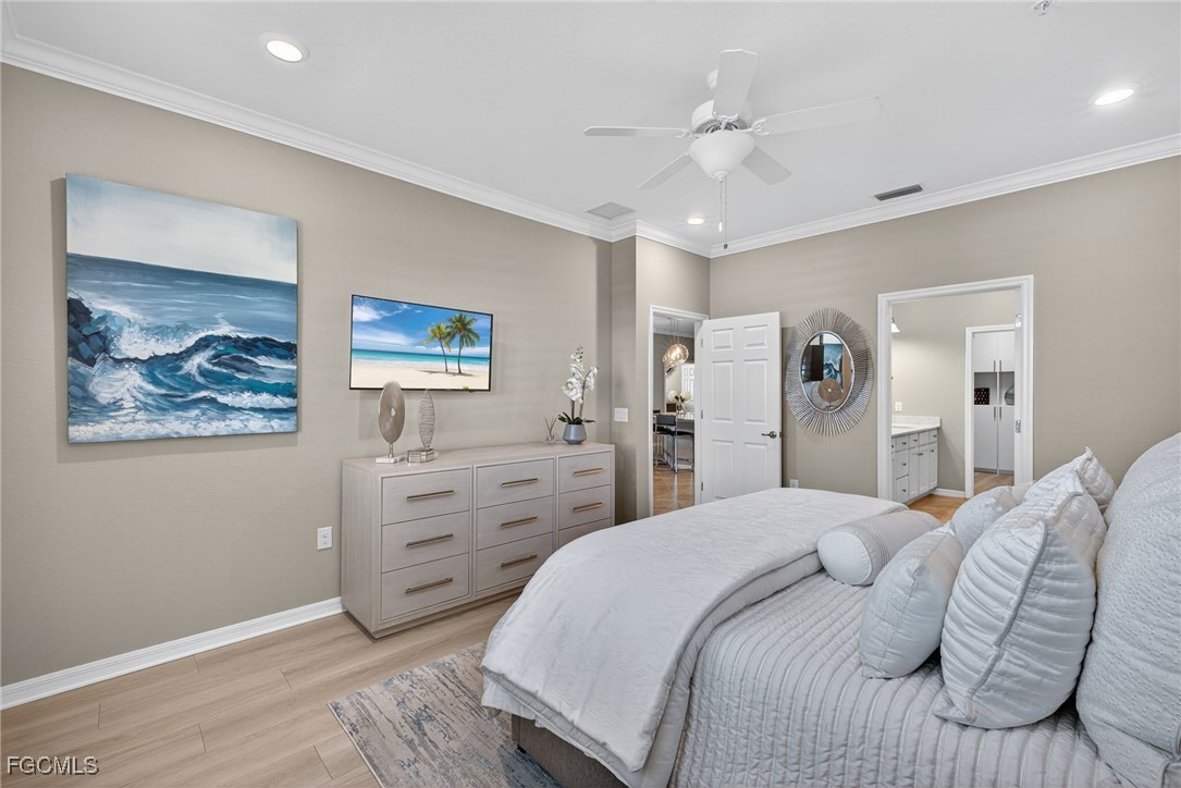 11768 Grand Belvedere Way, Unit 203 Fort Myers, FL 33913 - Photo 14 of 47 a bedroom with a bed and a painting