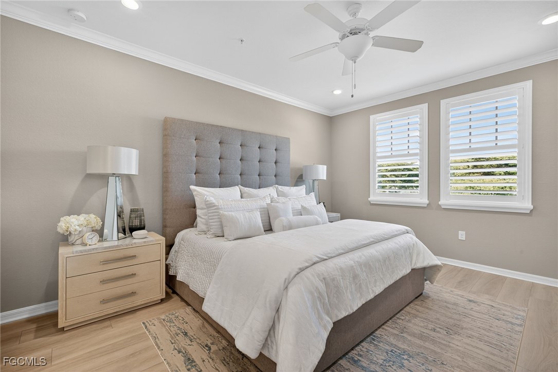 11768 Grand Belvedere Way, Unit 203 Fort Myers, FL 33913 - Photo 16 of 47 a bedroom with a large bed and a window