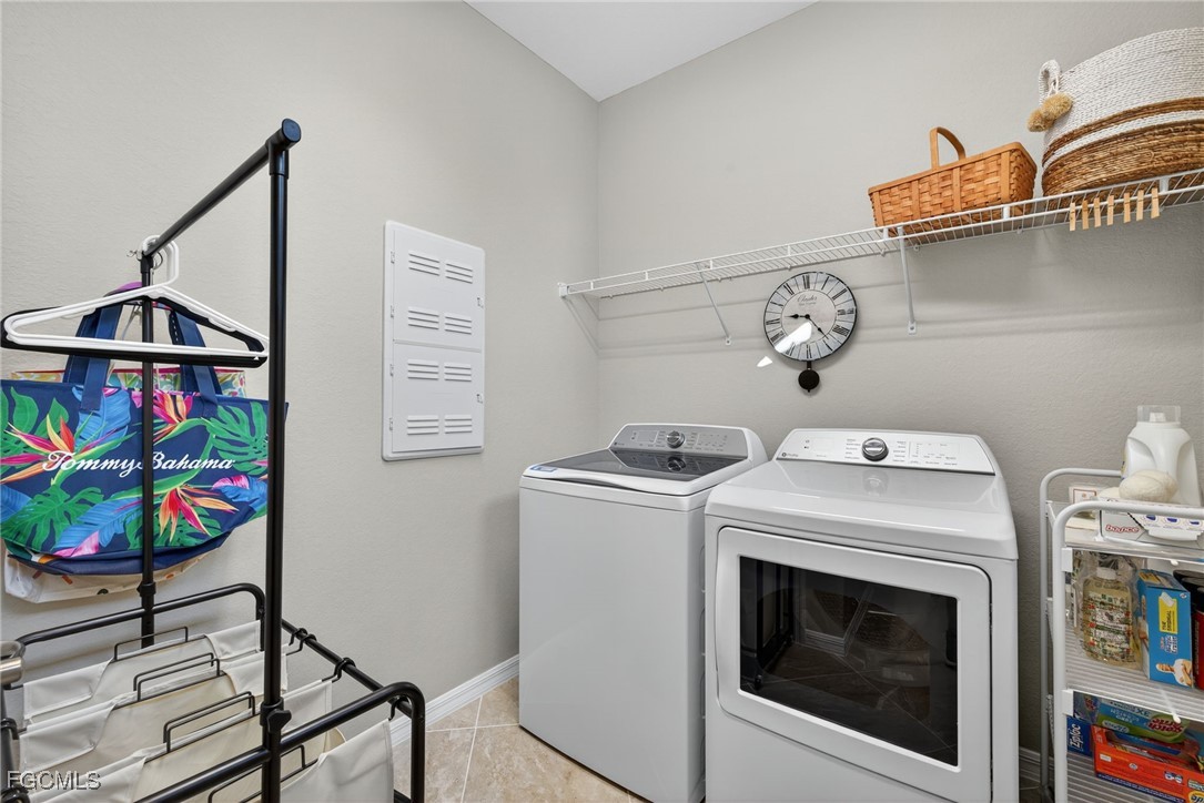 11768 Grand Belvedere Way, Unit 203 Fort Myers, FL 33913 - Photo 23 of 47 a utility room with dryer and washer
