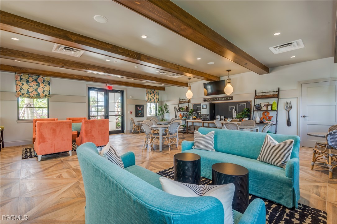 11768 Grand Belvedere Way, Unit 203 Fort Myers, FL 33913 - Photo 37 of 47 a living room with furniture and a large window