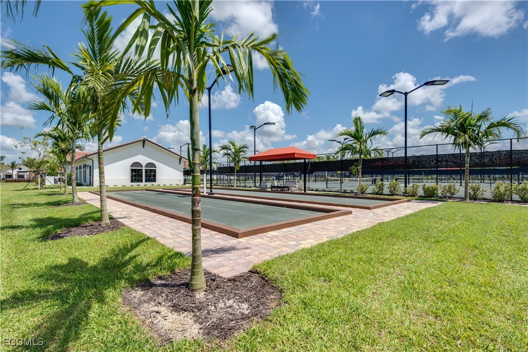 11768 Grand Belvedere Way, Unit 203 Fort Myers, FL 33913 - Photo 45 of 47 a view of a house with backyard and sitting area