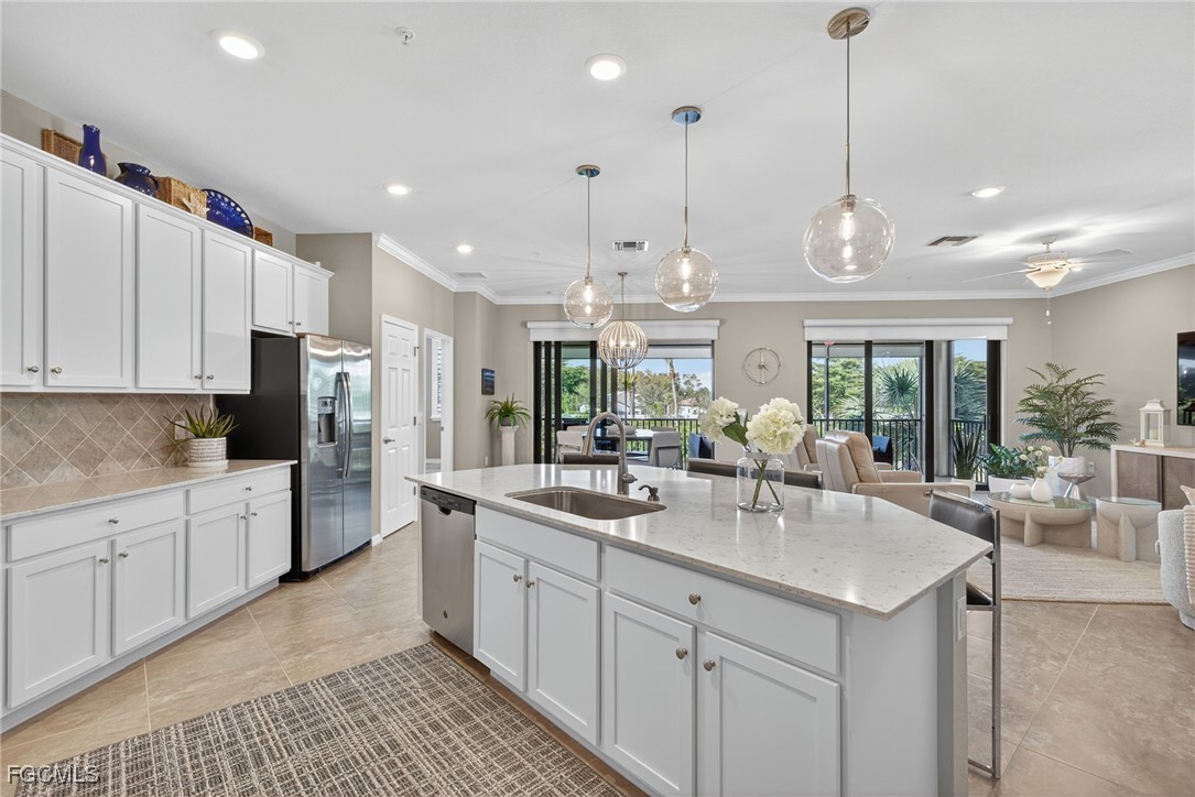 11768 Grand Belvedere Way, Unit 203 Fort Myers, FL 33913 - Photo 9 of 47 a kitchen with counter space sink and appliances