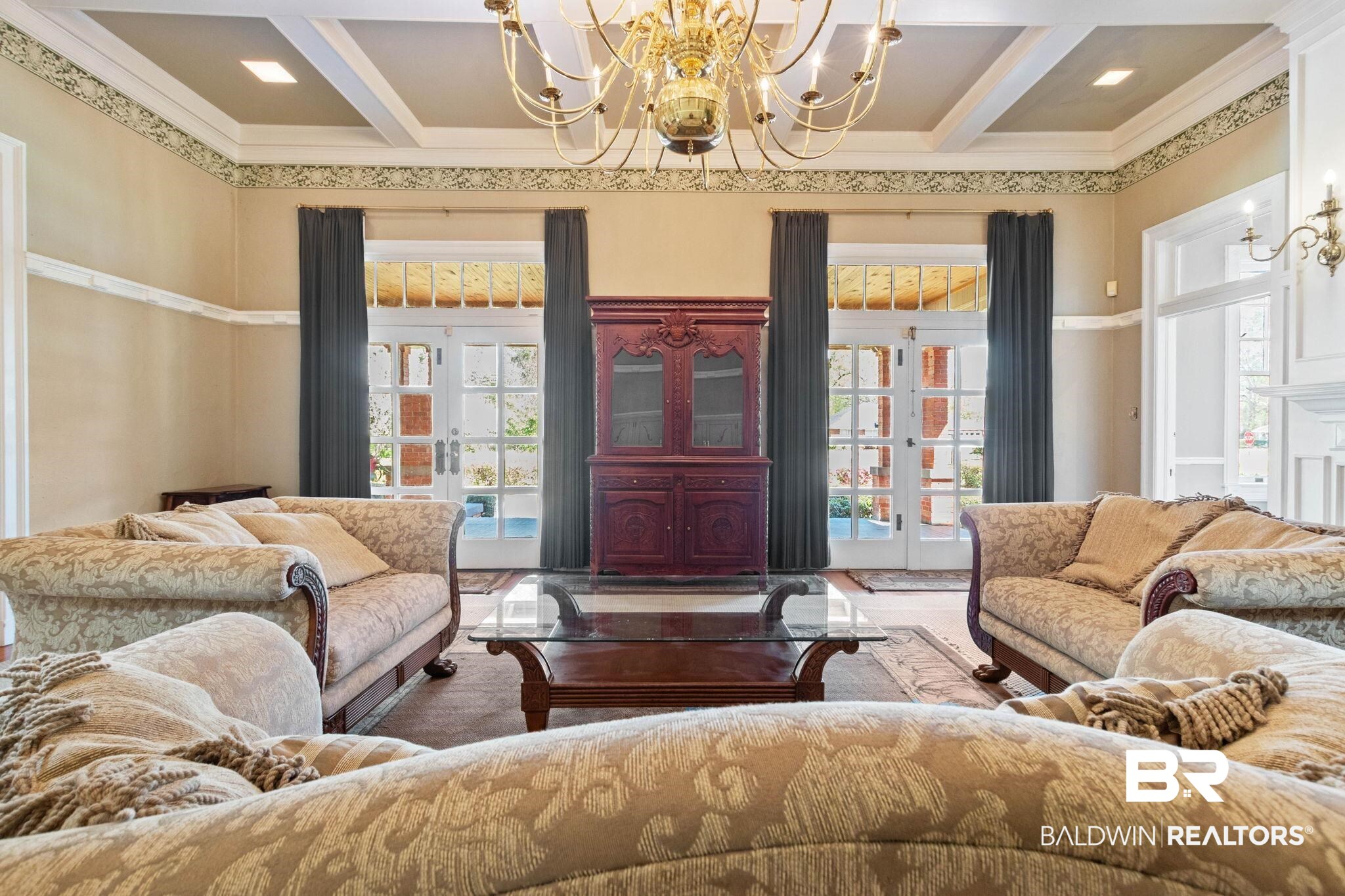 1701 Sowell Road Brewton, AL 36426 - Photo 24 of 83 Living room with french doors, a chandelier, crown molding, and coffered ceiling