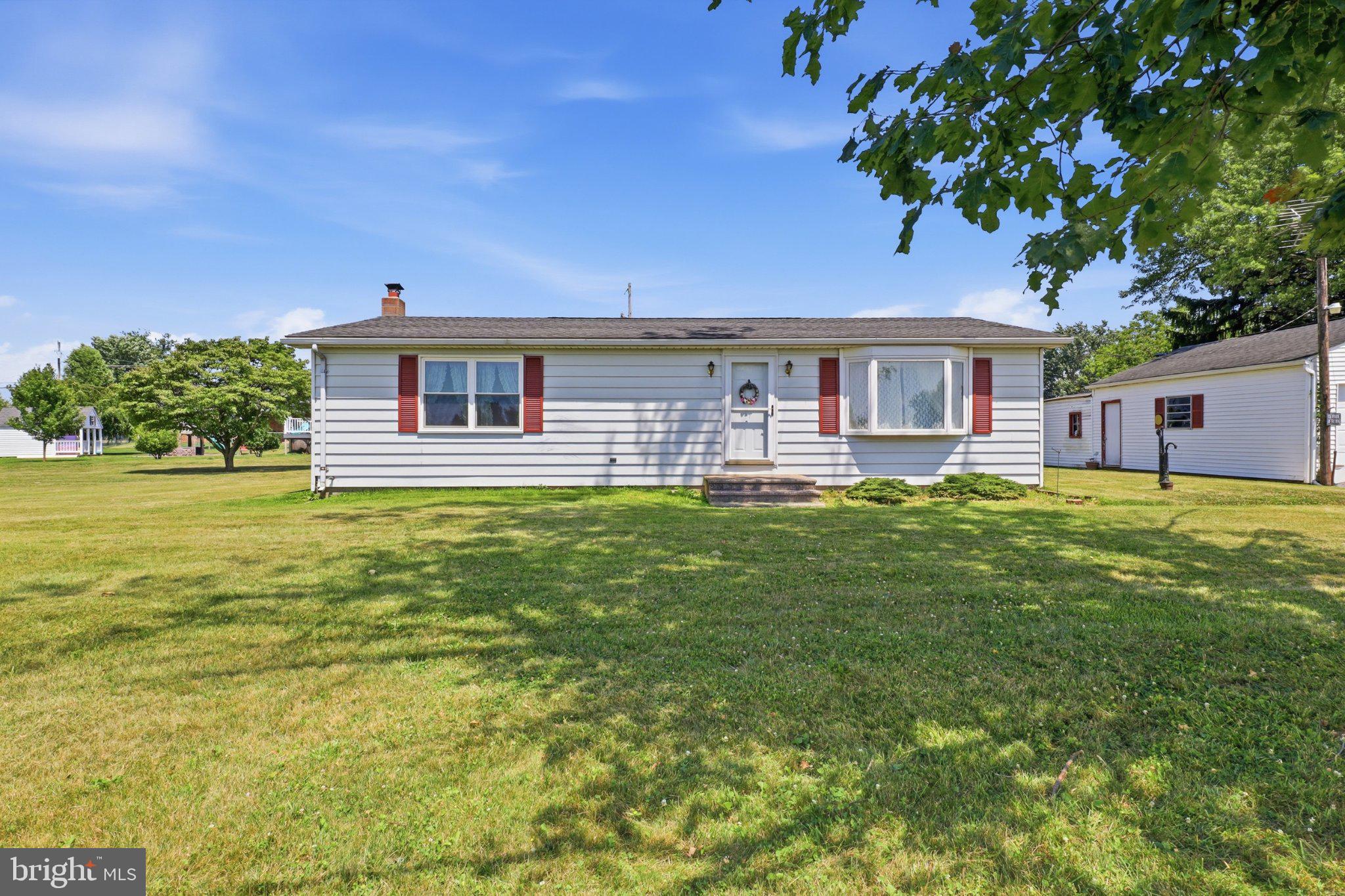 Charming home on spacious green lot.