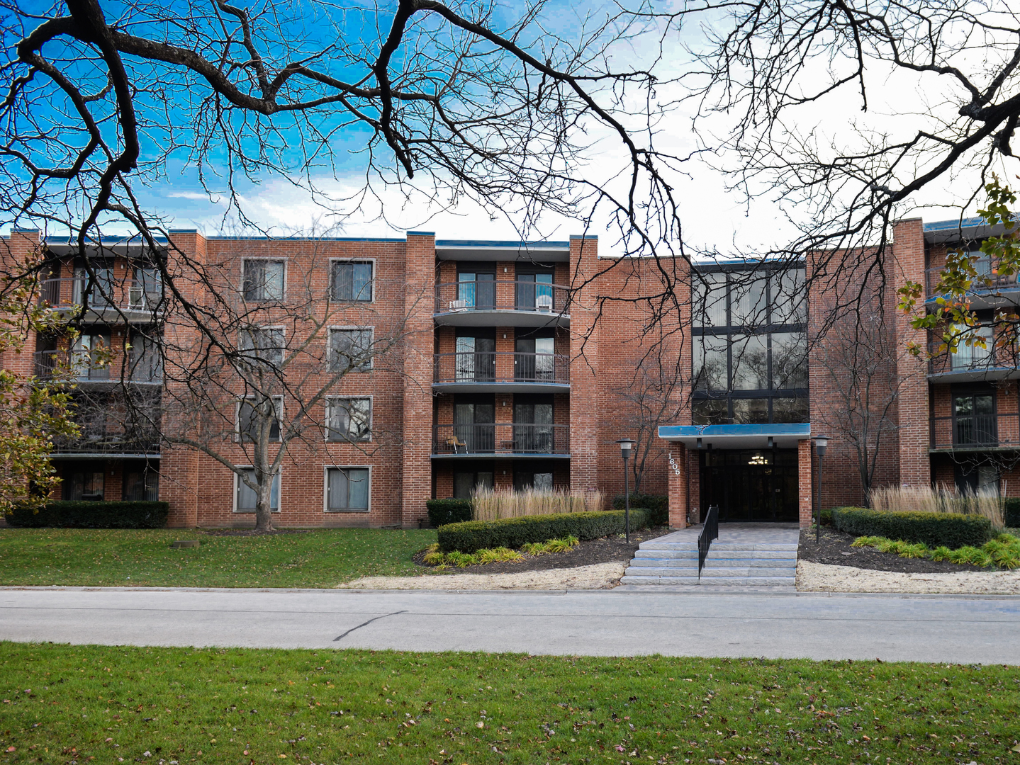 1605 East Central Road, Unit 203A Arlington Heights, IL 60005 - Photo 1 of 11 a front view of a house