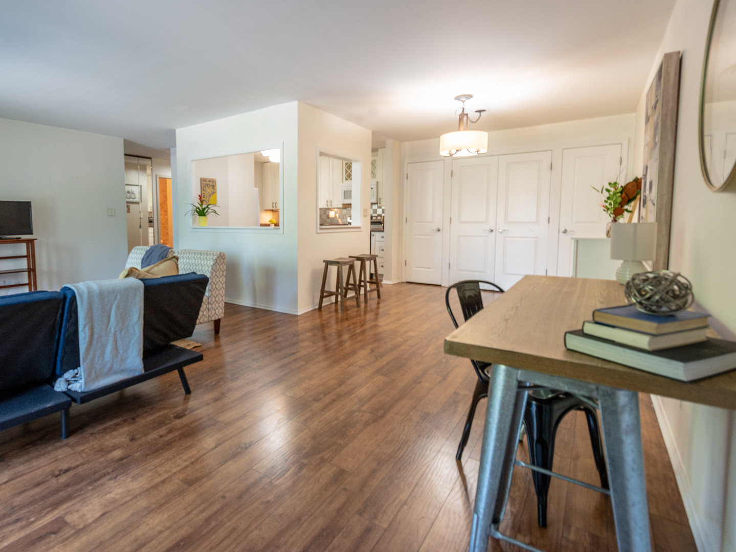 1605 East Central Road, Unit 203A Arlington Heights, IL 60005 - Photo 4 of 11 a view of a dining room with furniture and wooden floor