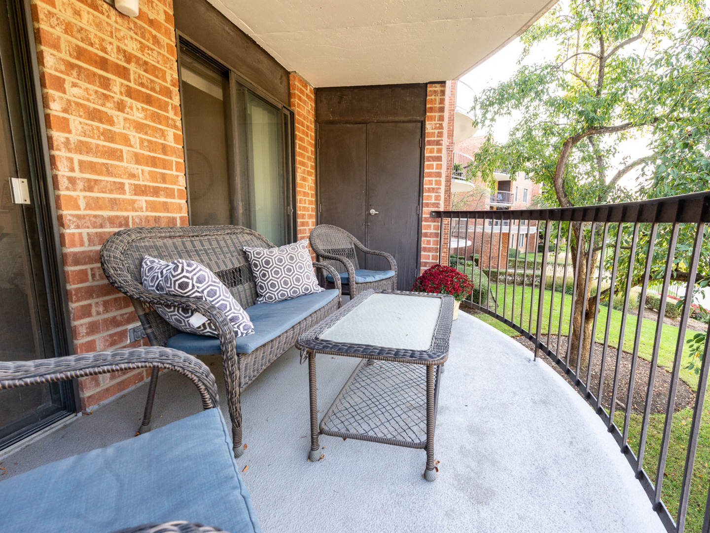 1605 East Central Road, Unit 203A Arlington Heights, IL 60005 - Photo 10 of 11 a living room with furniture and a floor to ceiling window