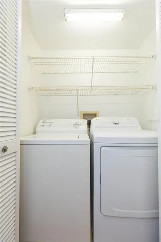 a utility room with dryer and washer