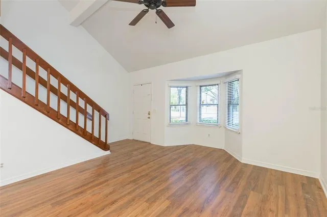 a view of an entryway with wooden floor