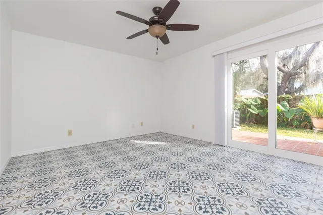 a view of empty room with floor to ceiling window