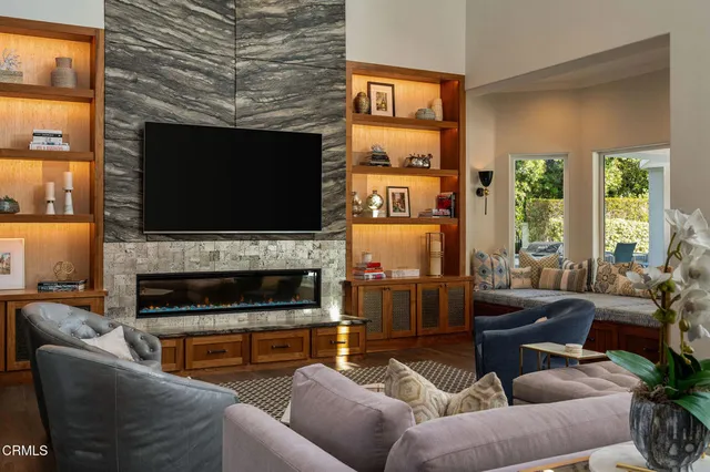 a dining hall with stainless steel appliances kitchen island granite countertop a sink and a granite counter tops