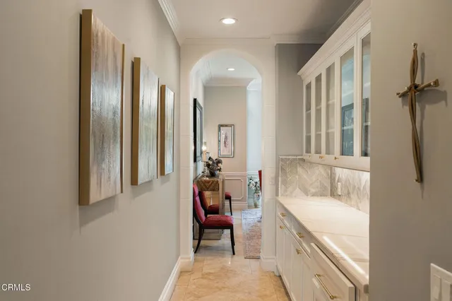 a bedroom with a balcony a bed and a flat screen tv