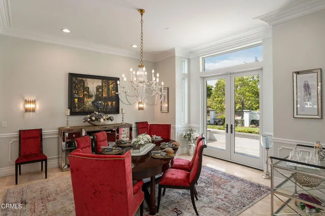 a bathroom with a window a sink and a mirror