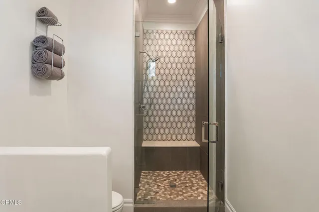 a front view of a house with swimming pool having outdoor seating