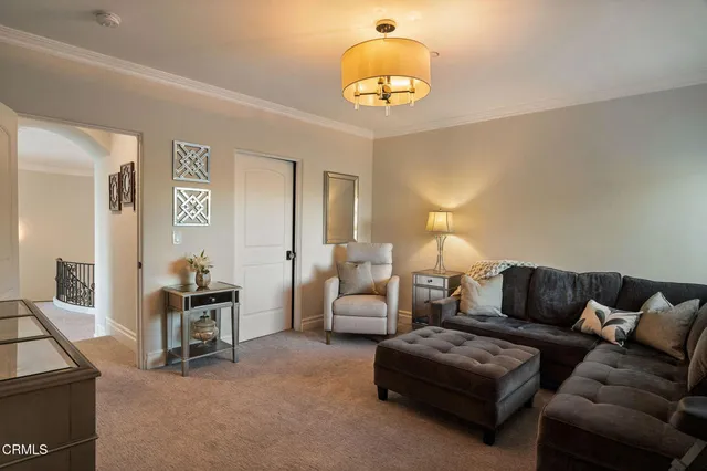 a view of swimming pool with outdoor seating and plants