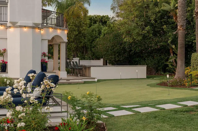 a view of a swimming pool with outdoor seating