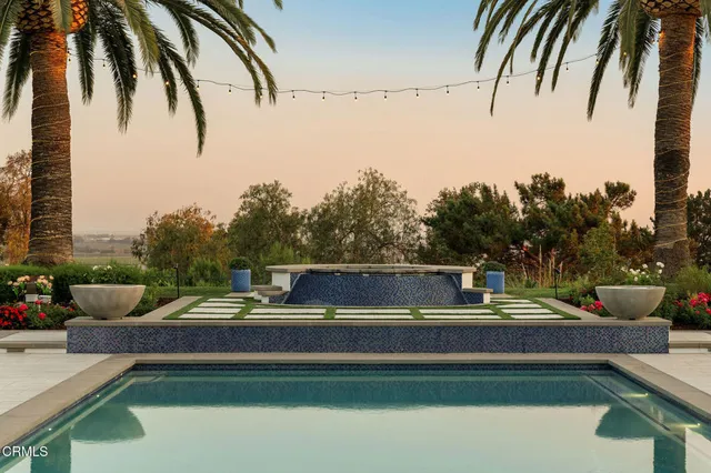 a view of a patio with table and chairs