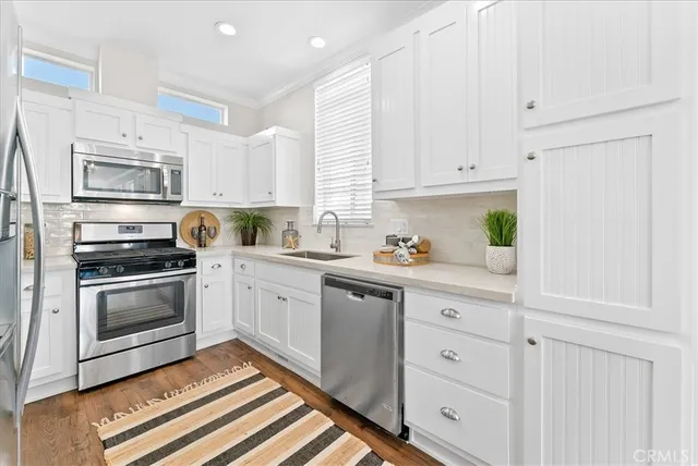 a bedroom with a bed window and a lamp