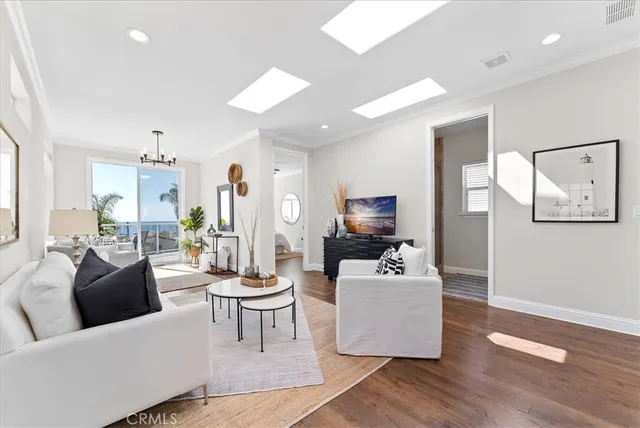 a kitchen with a white cabinets and chairs