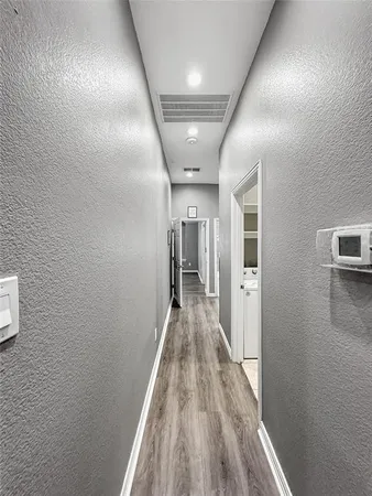 a kitchen with granite countertop white cabinets and stainless steel appliances
