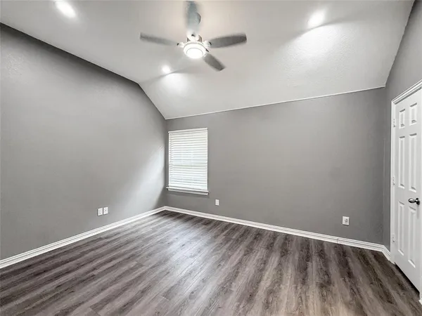 a bathroom with a granite countertop toilet a sink and bathtub
