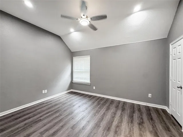 a bathroom with a granite countertop toilet a sink and bathtub