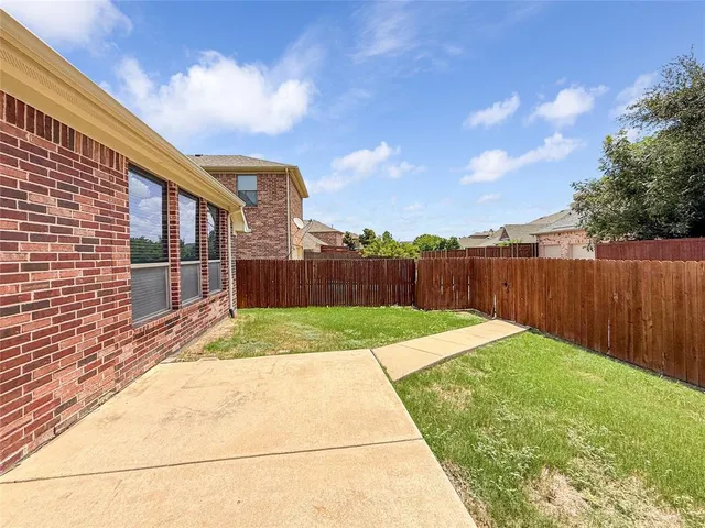 a view of backyard with green space