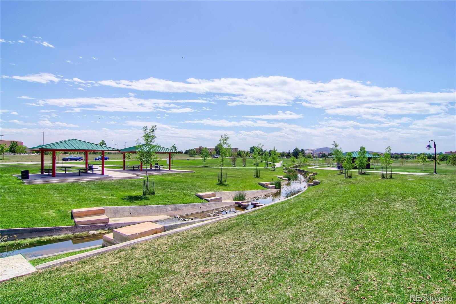 908 Syracuse Street Denver, CO 80230 - Photo 26 of 28 a view of a big yard with plants and large trees