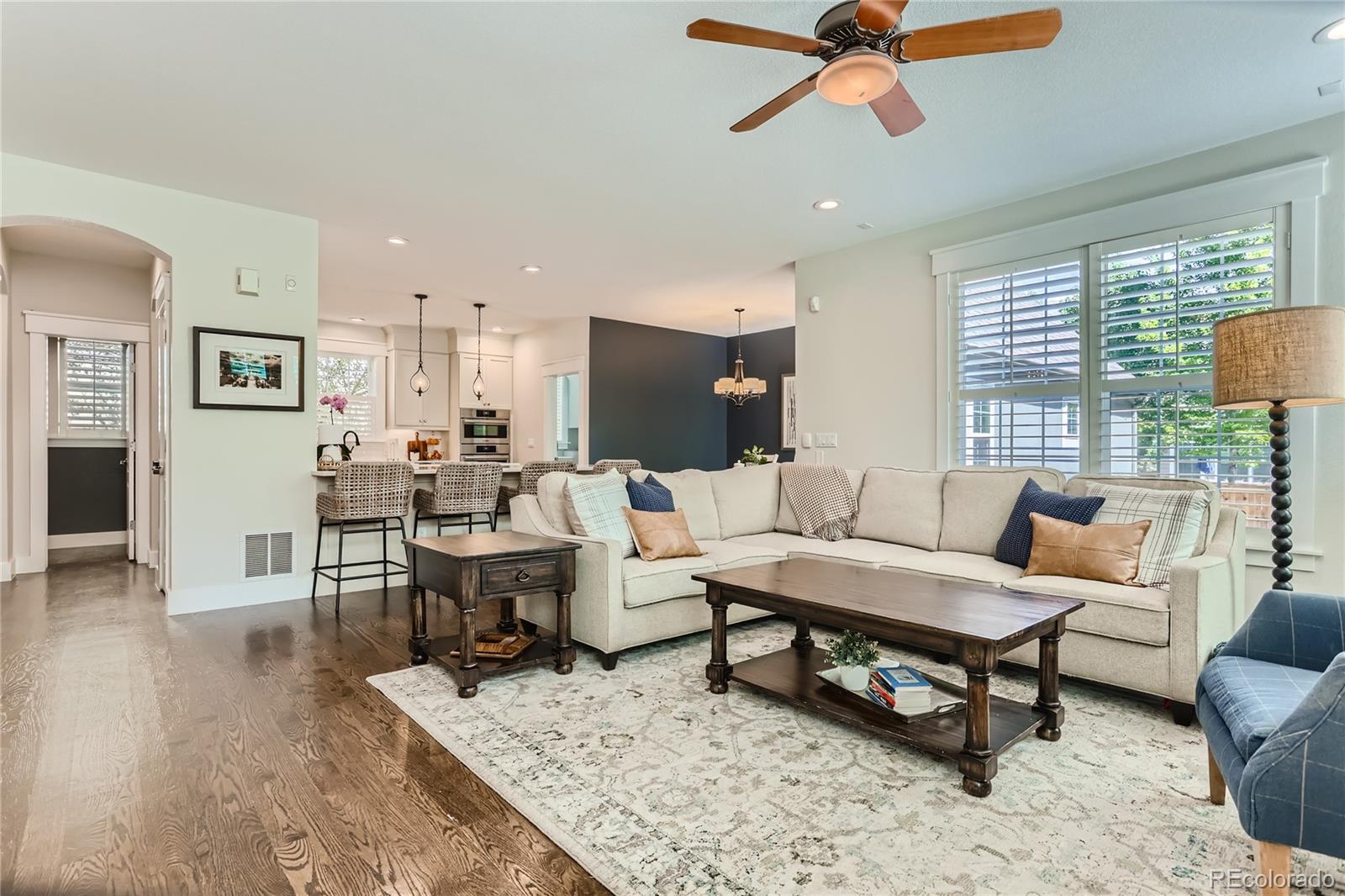 908 Syracuse Street Denver, CO 80230 - Photo 5 of 28 a living room with furniture and a wooden floor