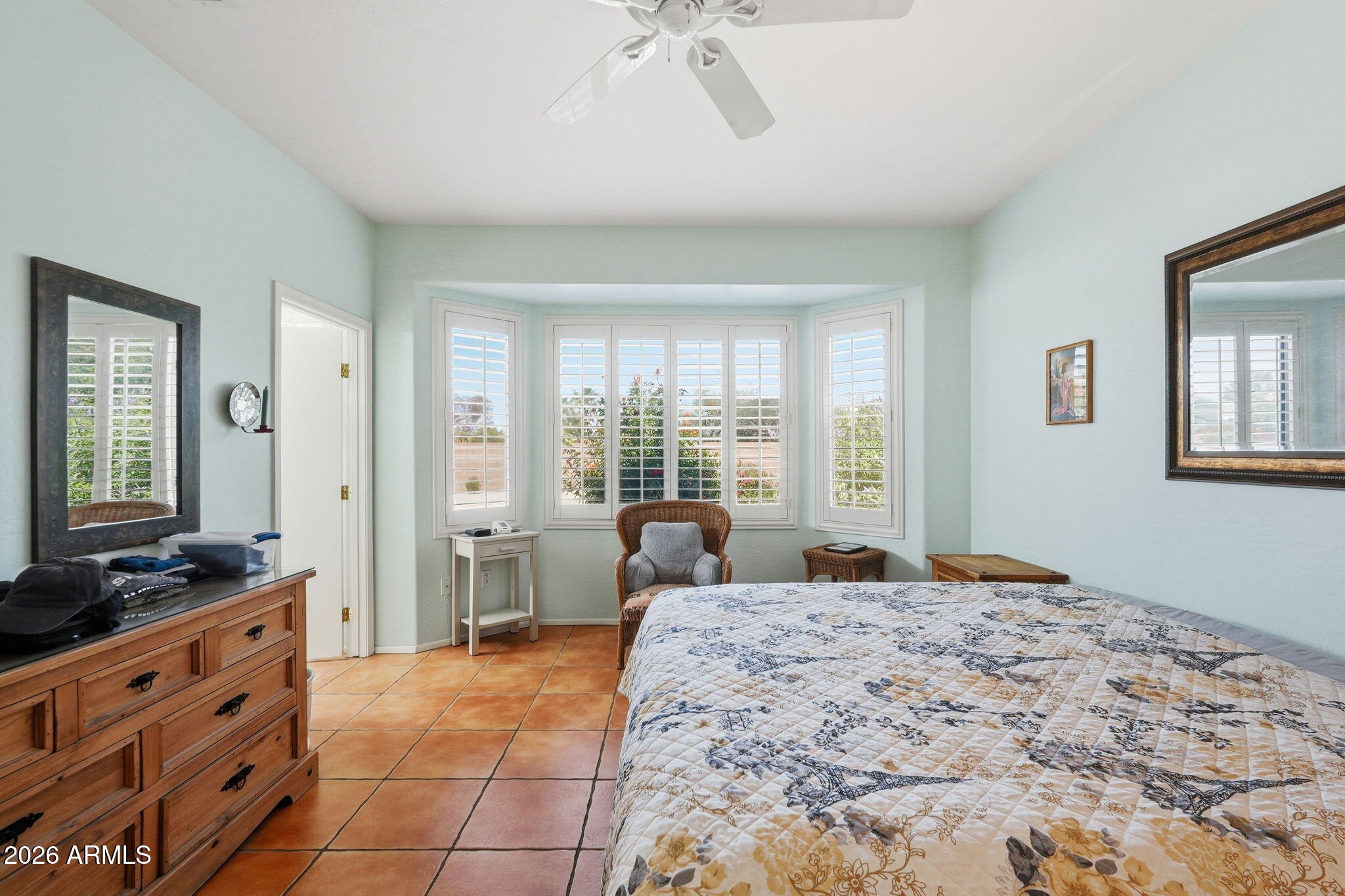 19113 North Hunters Run Surprise, AZ 85387 - Photo 11 of 45 a bedroom with a large bed and a window