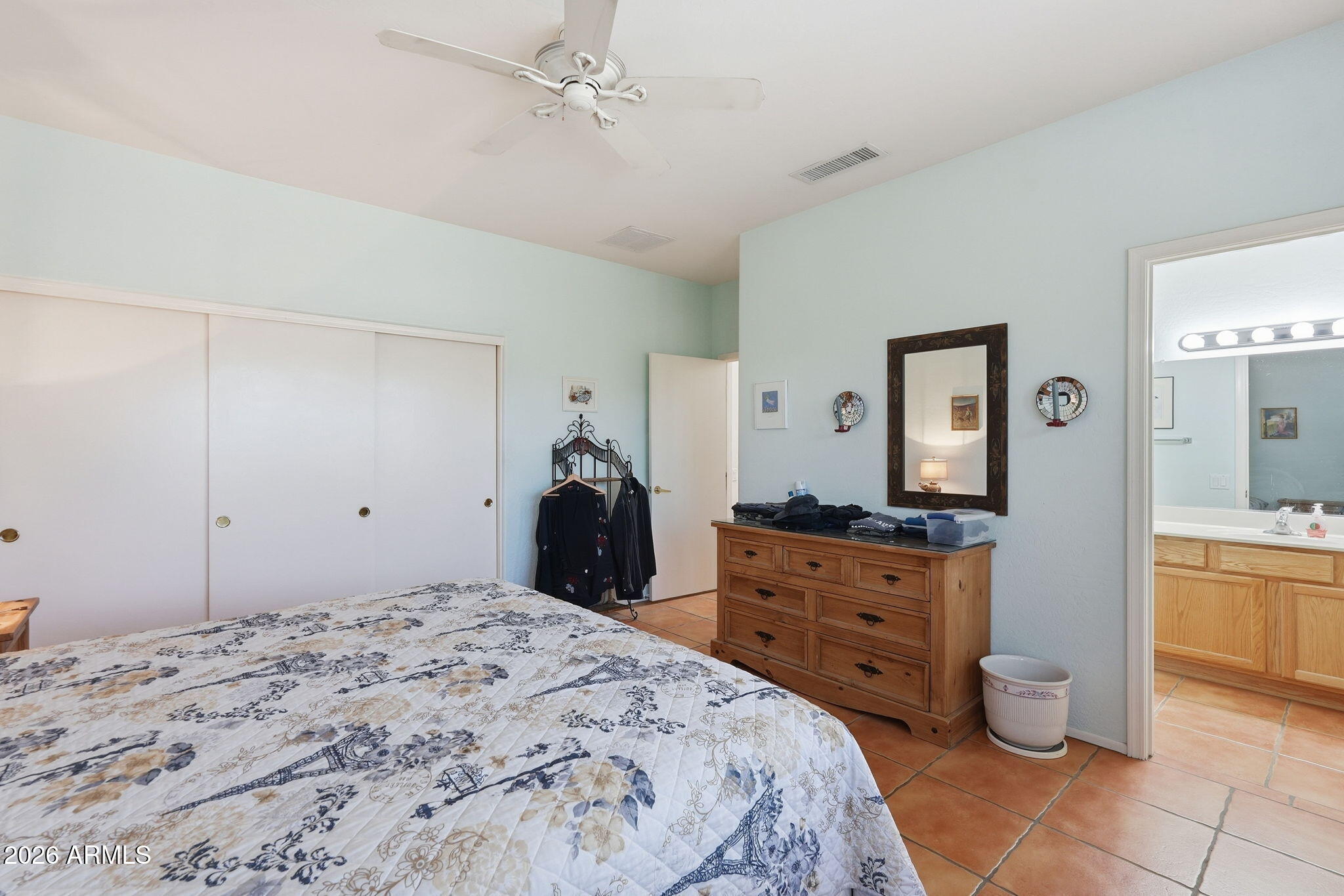 19113 North Hunters Run Surprise, AZ 85387 - Photo 12 of 45 a bedroom with a bed and a dresser in it