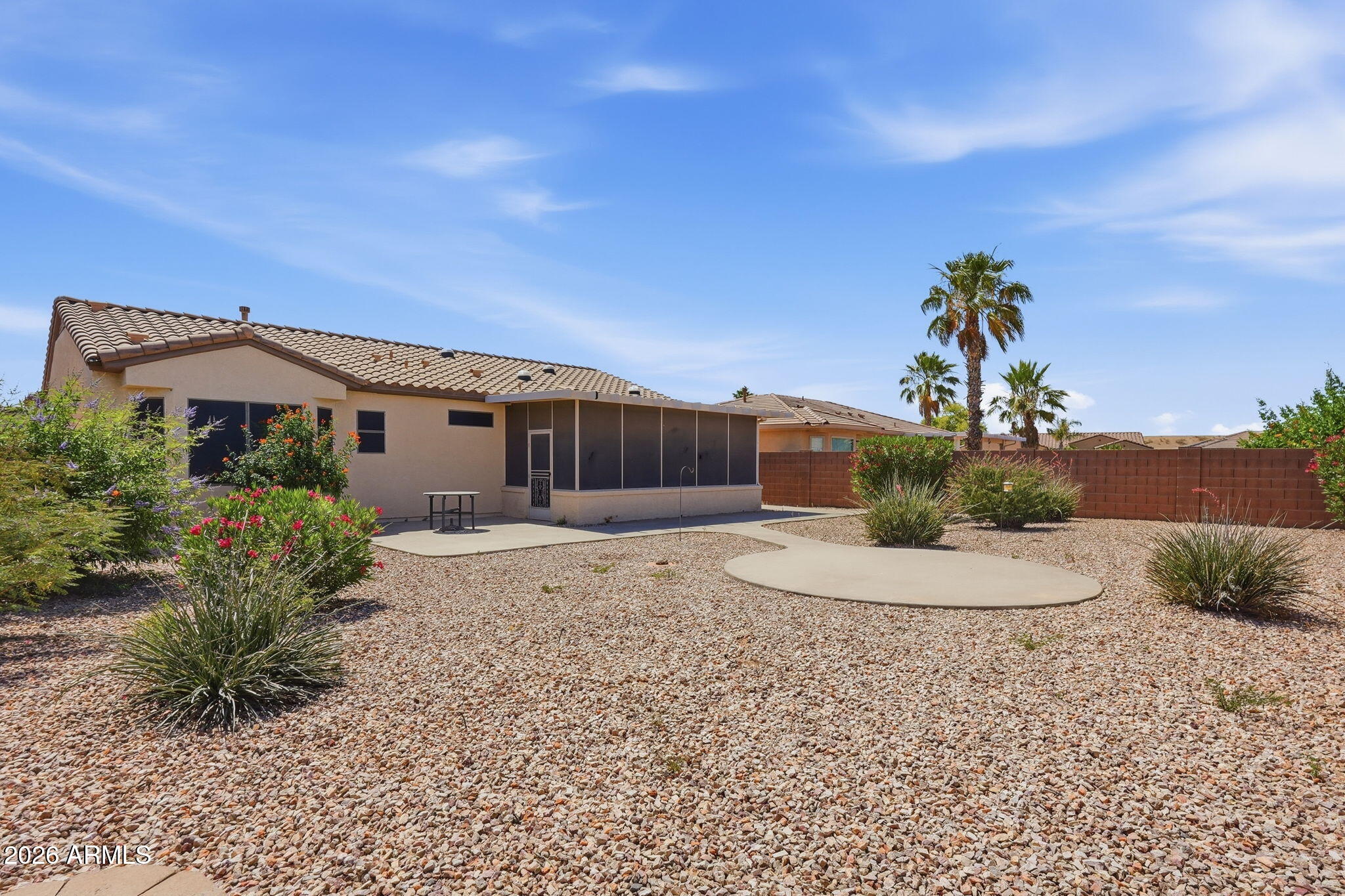 19113 North Hunters Run Surprise, AZ 85387 - Photo 19 of 45 a front view of a house with a yard