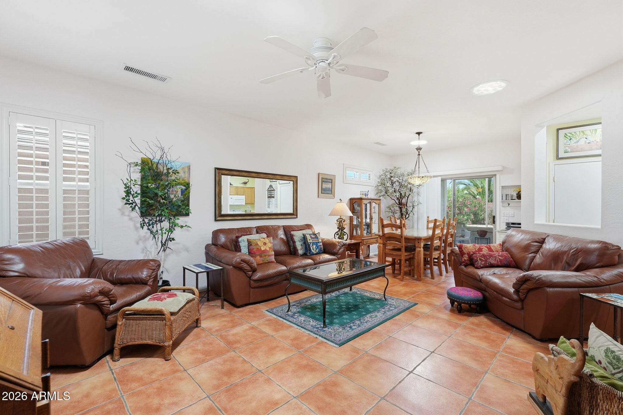 19113 North Hunters Run Surprise, AZ 85387 - Photo 2 of 45 a living room with furniture and a large window