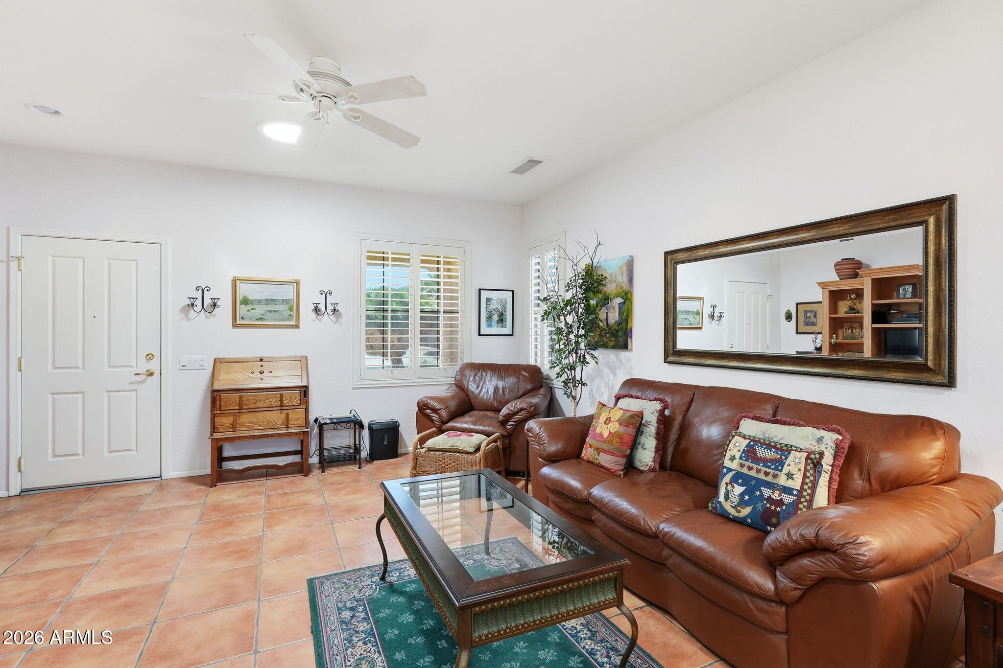 19113 North Hunters Run Surprise, AZ 85387 - Photo 3 of 45 a living room with furniture and a flat screen tv