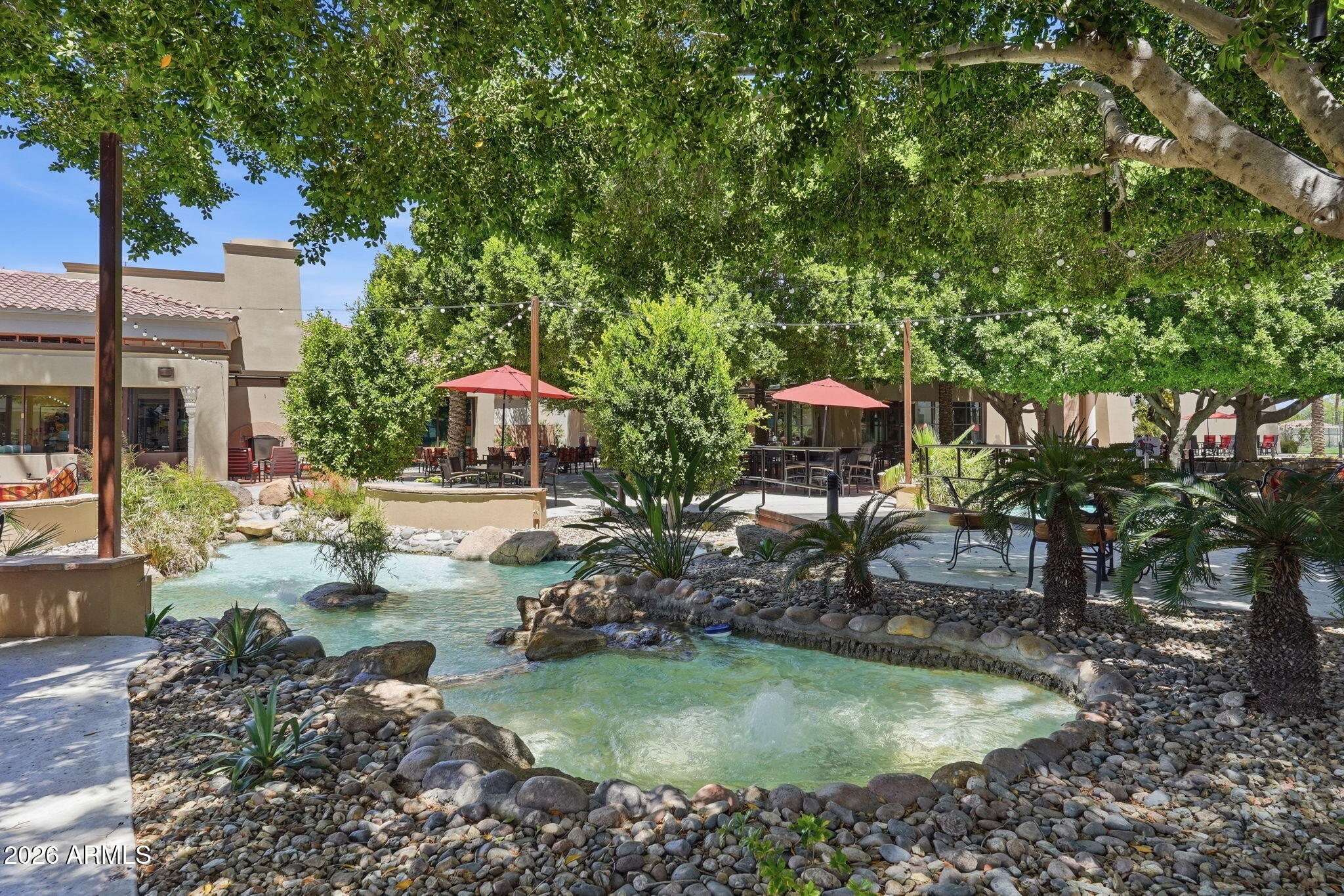 19113 North Hunters Run Surprise, AZ 85387 - Photo 42 of 45 a view of pool with lawn chairs and plants