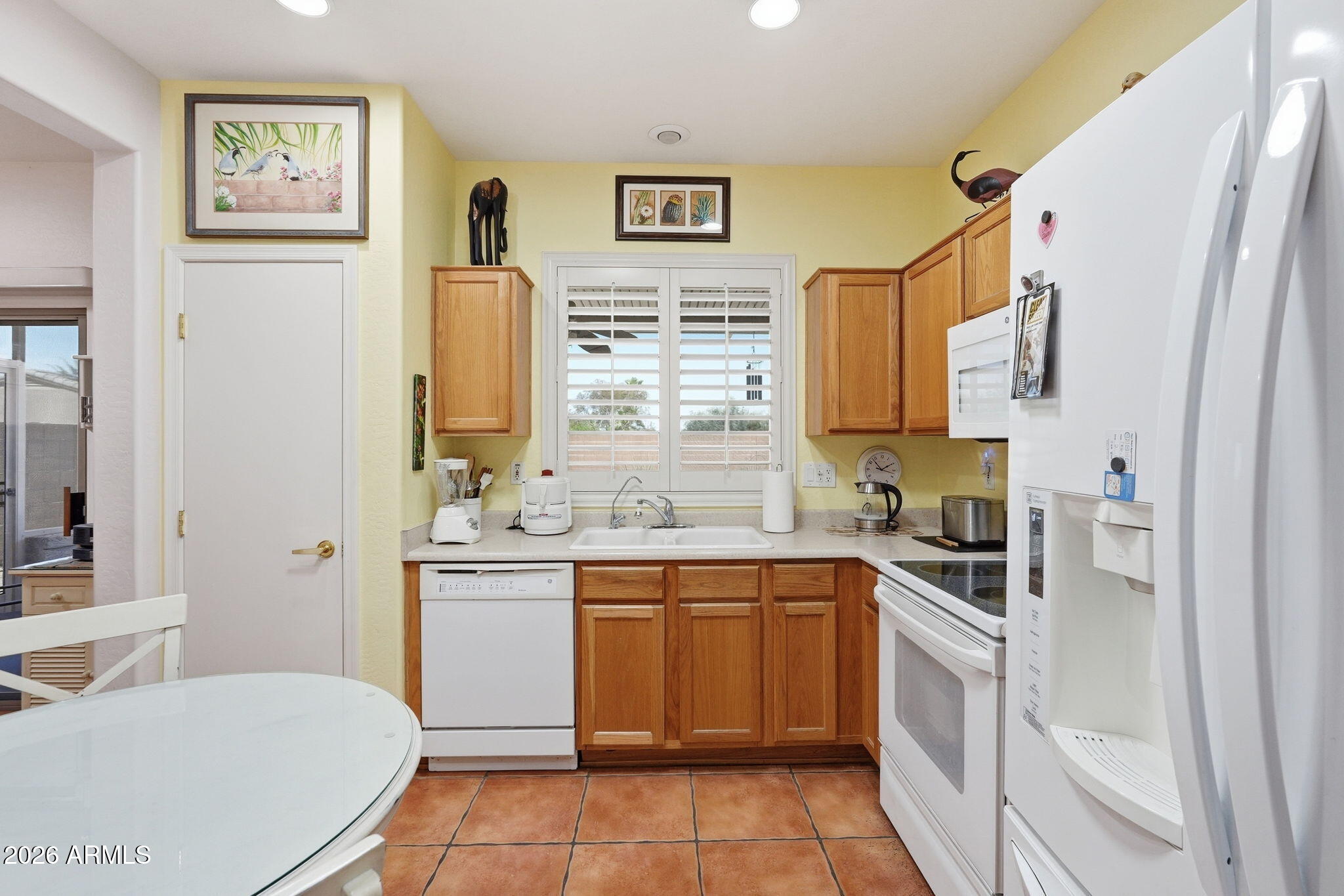 19113 North Hunters Run Surprise, AZ 85387 - Photo 9 of 45 a kitchen with a sink stove and cabinets