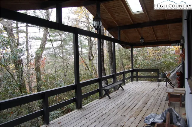 a view of balcony with wooden floor