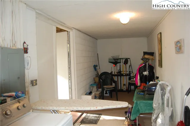 a view of a livingroom with furniture and gym equipment