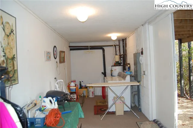 a backyard of a house with lots of plants and trees