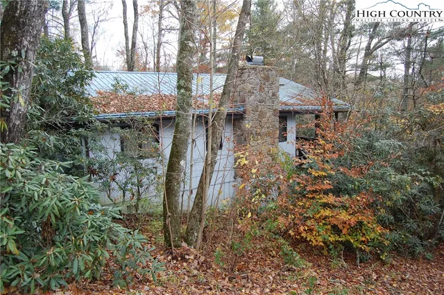 a aerial view of a house with a yard