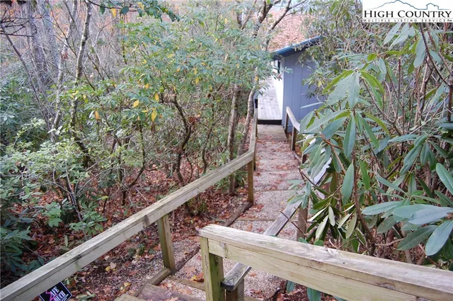 a view of a house with a tree