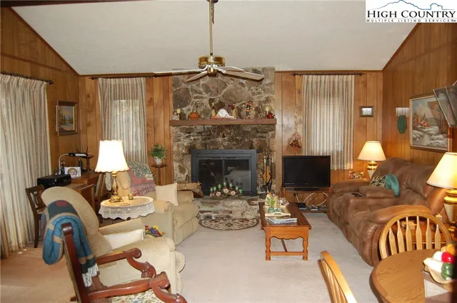 a view of a livingroom with furniture and a fireplace