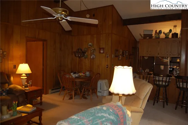 a dining room with a table and chairs